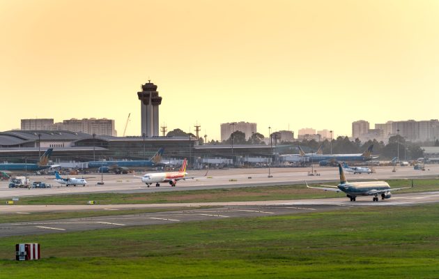 Passenger jets on runway.